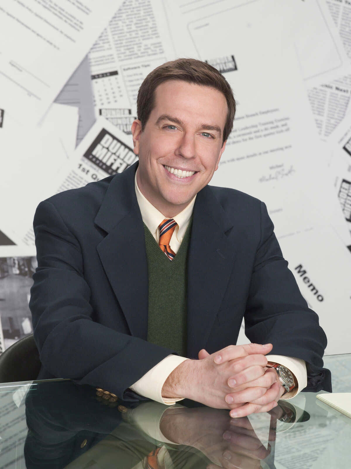 Comedic Actor Ed Helms In A Casual Interview Photo. Background
