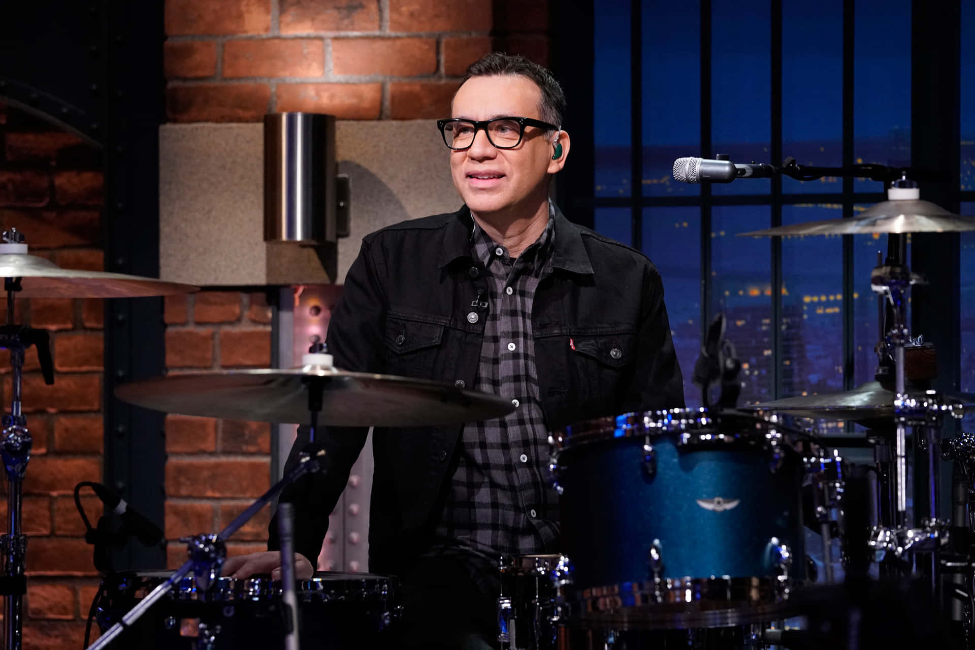 Comedic Genius Fred Armisen Glancing Sideway Background