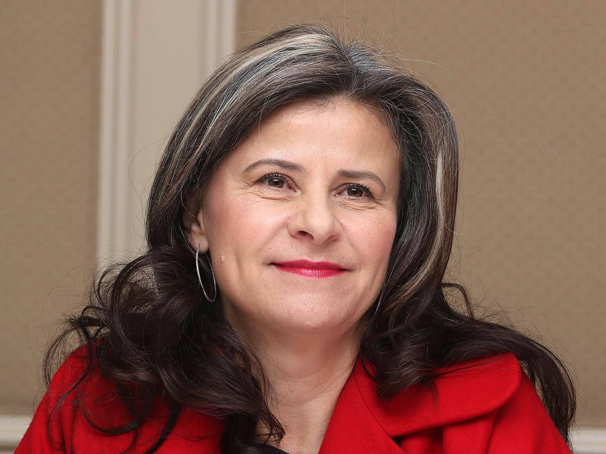 Comedic Star, Tracey Ullman, Radiating Confidence In A Chic Red Outfit Background