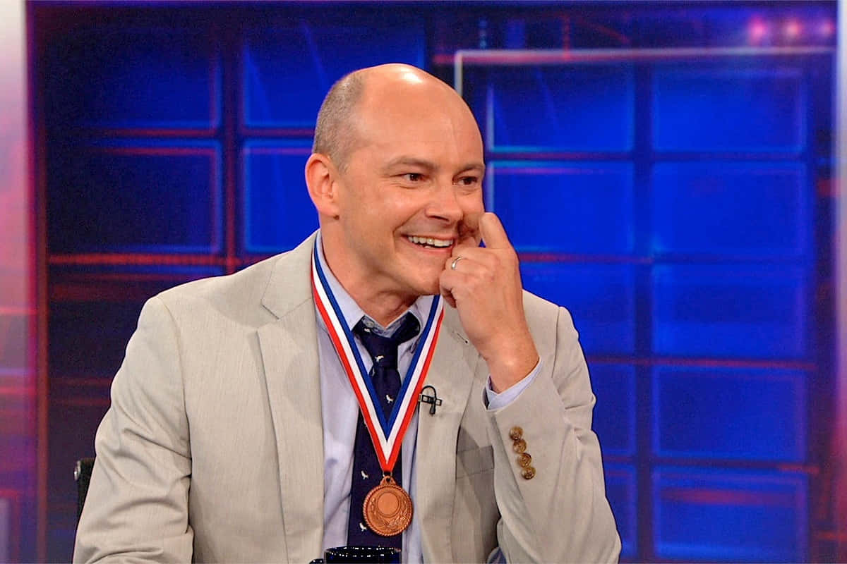 Comedic Talent Rob Corddry Posing For A Portrait. Background