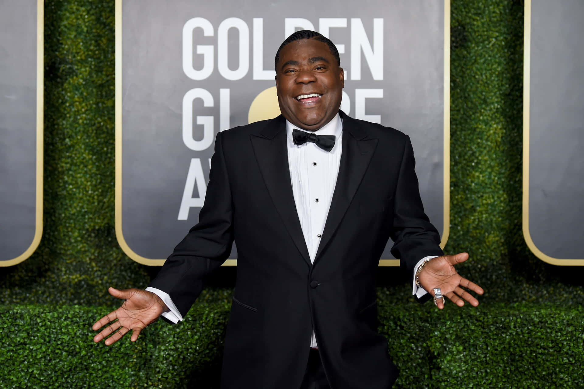 Comedy Icon Tracy Morgan Spotlighted Against A Dark Backdrop Background