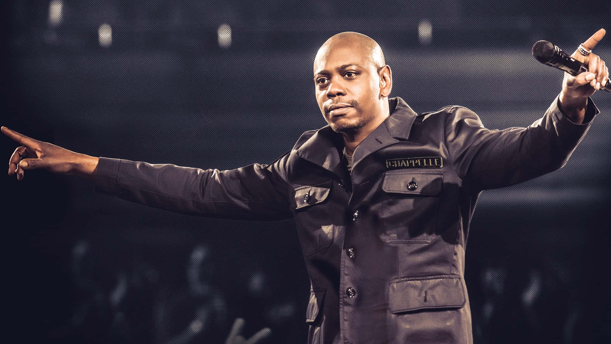Comedy King Dave Chappelle Performing Live Background