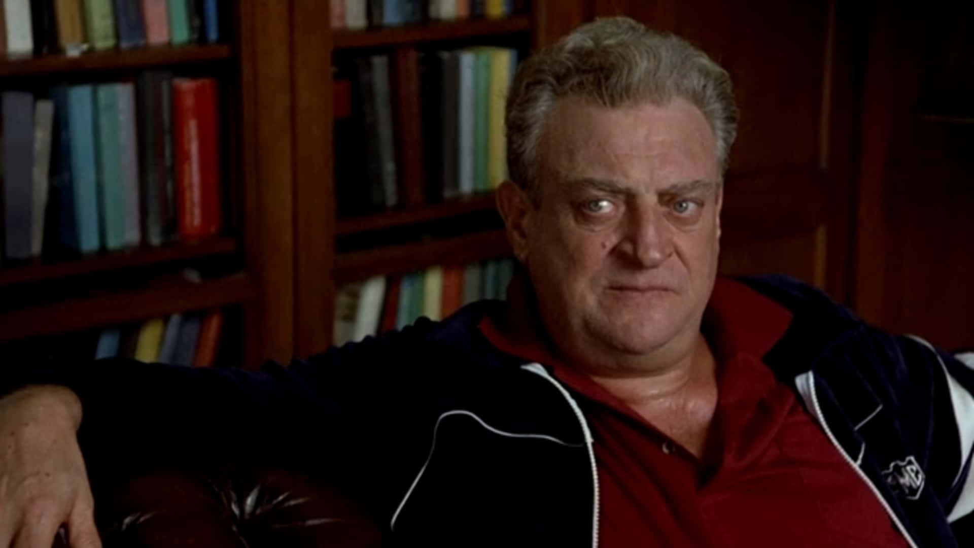 Comedy Legend Rodney Dangerfield Displaying Angry Expression Background