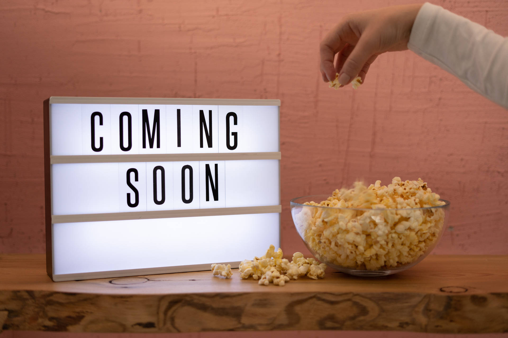 Coming Soon Hand Taking Popcorn Background