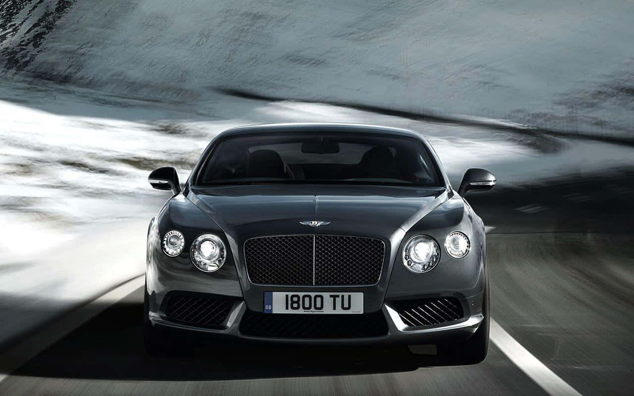 Command The Road With Bentley Sport Background