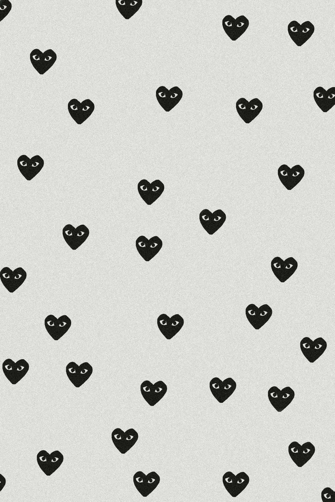 Comme Des Garçons Iconic Hearts On Gray Background