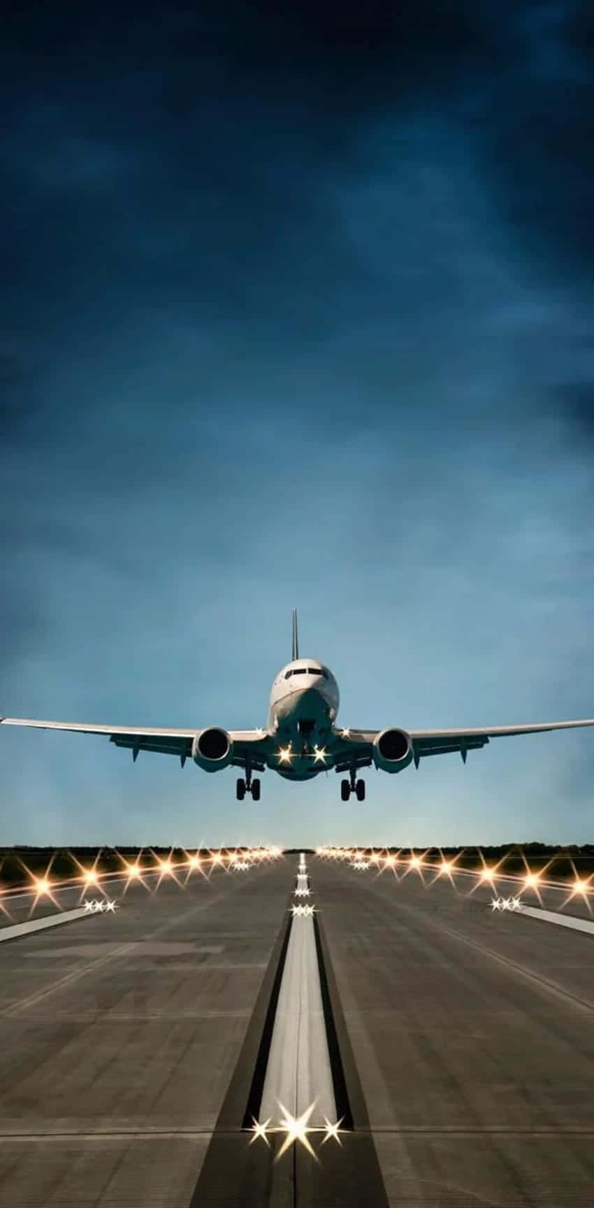 Commercial Airplane Landingat Dusk Background