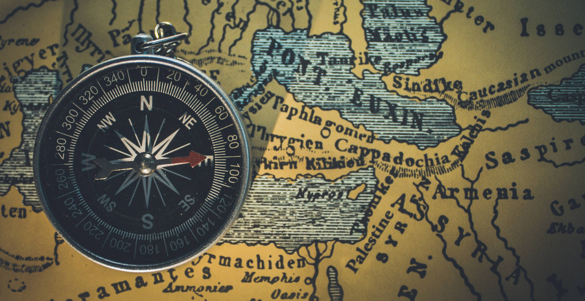 Compass On Top Of A Map Background