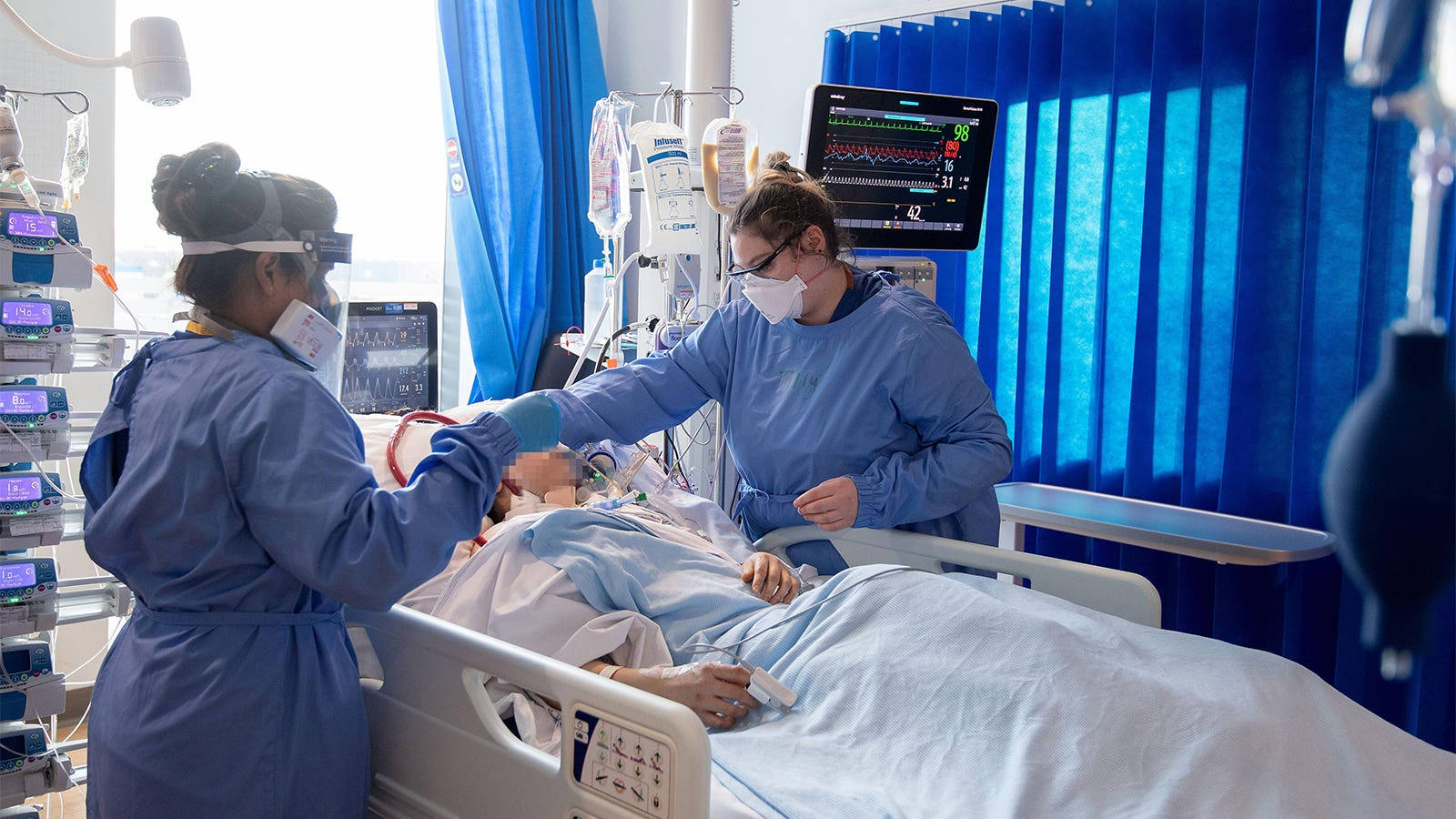 Compassionate Healthcare: A Nurse In An Intensive Care Unit Background