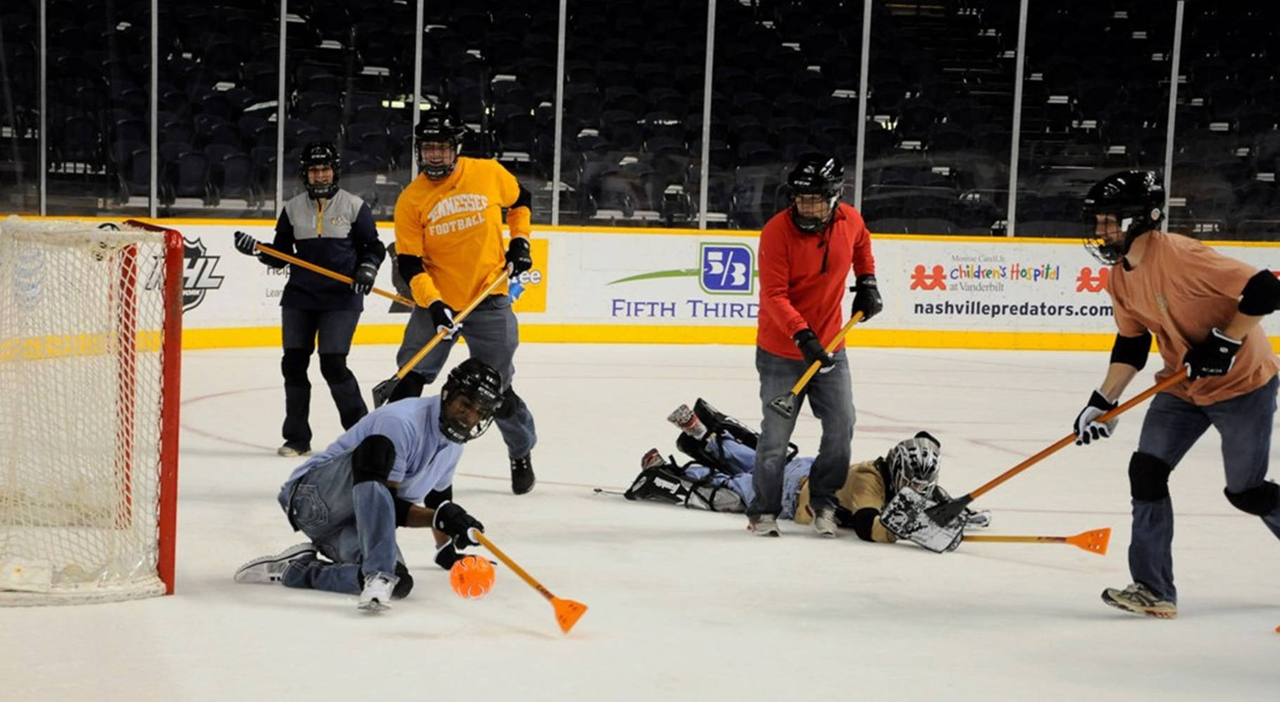 Competitive Broomball Team In Action Background