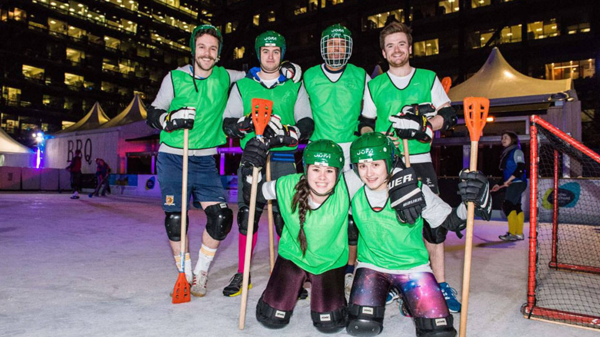 Competitive Broomball Teams In Action Background