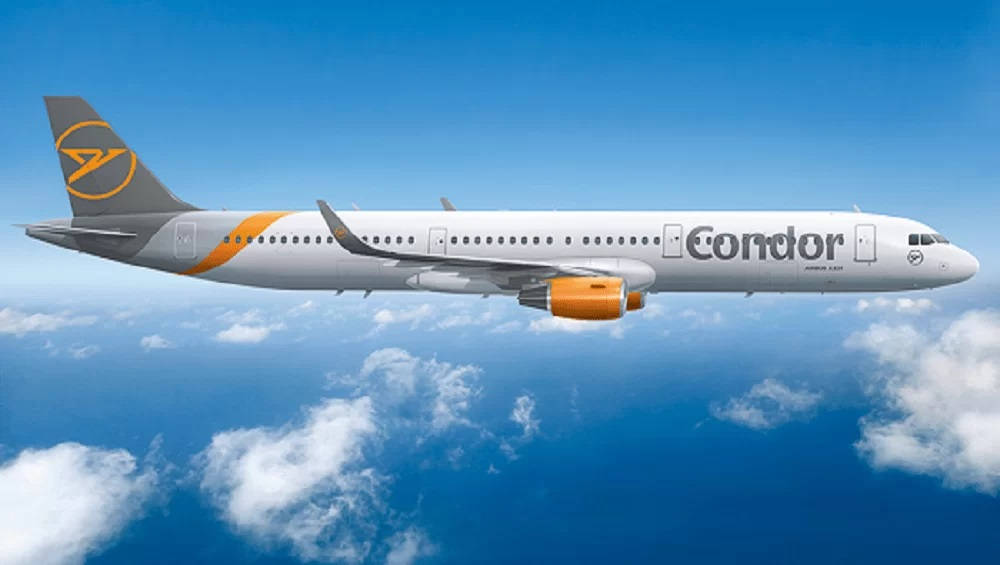 Condor Airlines Aircraft Ascending In Cloudy Blue Sky Background