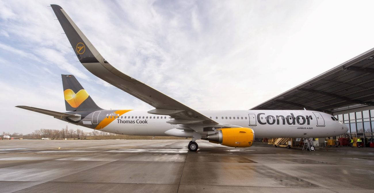 Condor Airlines Airplane Entering Airport Hangar Background