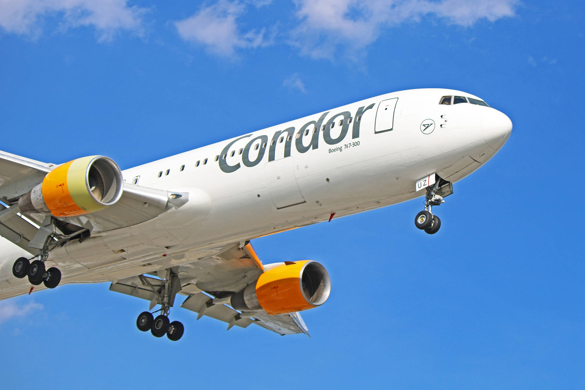 Condor Airlines Airplane In The Vast Sky Background