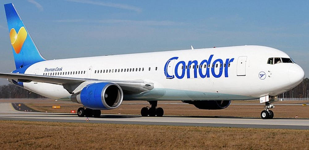 Condor Airlines Airplane Wheels On Runway Background