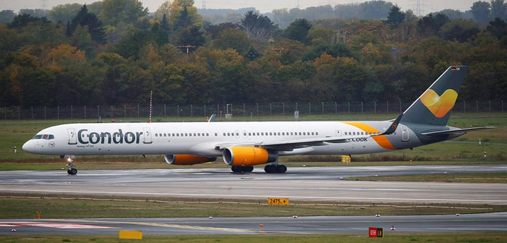 Condor Airlines Ariplane Taxiing On The Runway Background