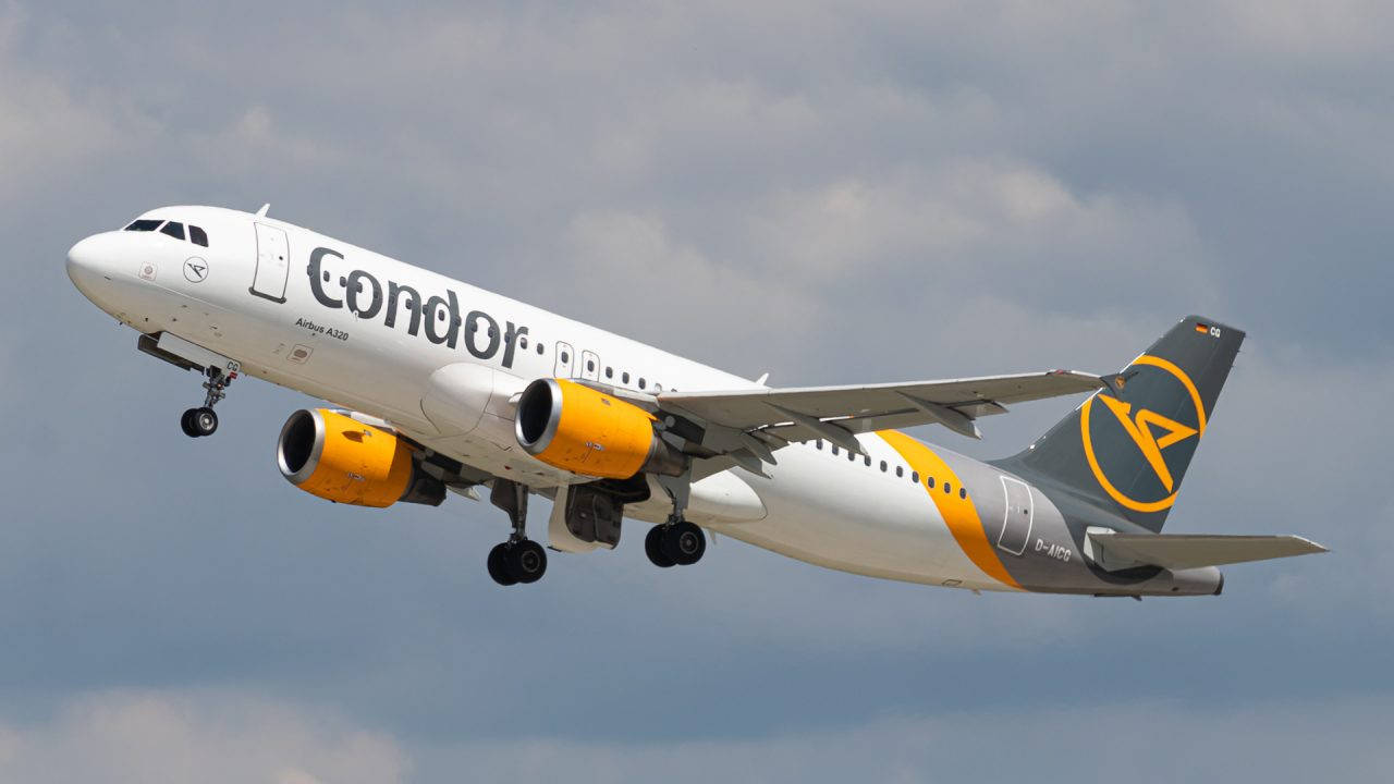 Condor Airlines Flying Passenger Airplane Background