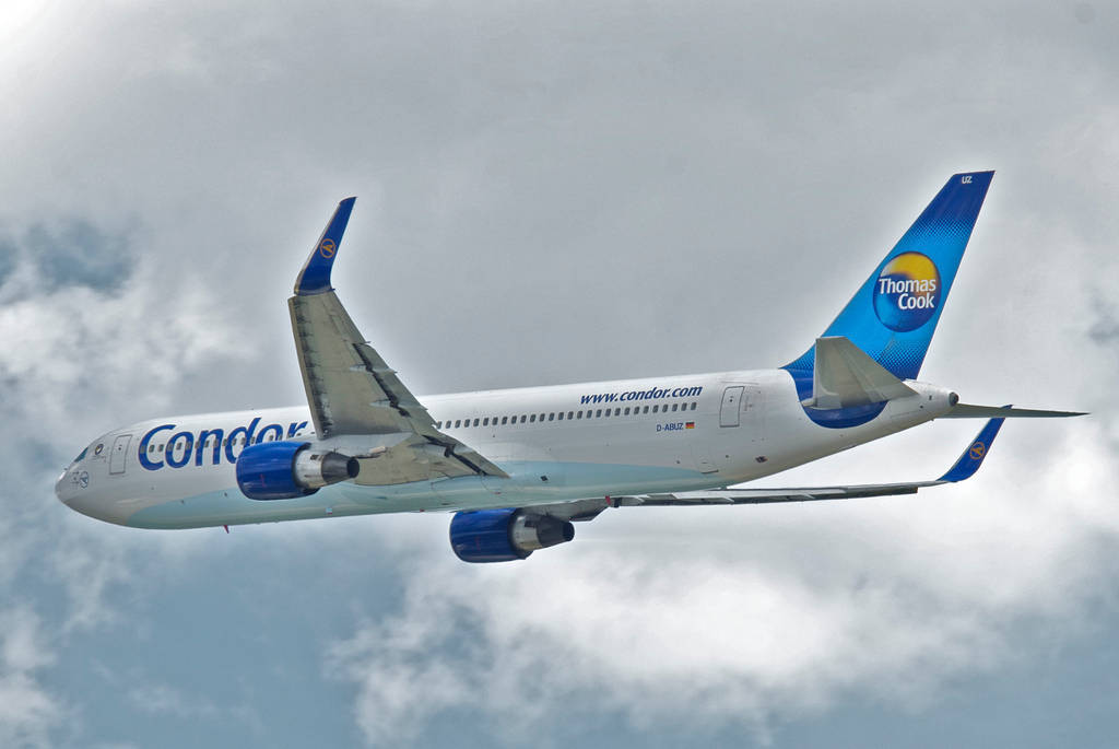 Condor Airlines Flying White And Blue Airplane Background