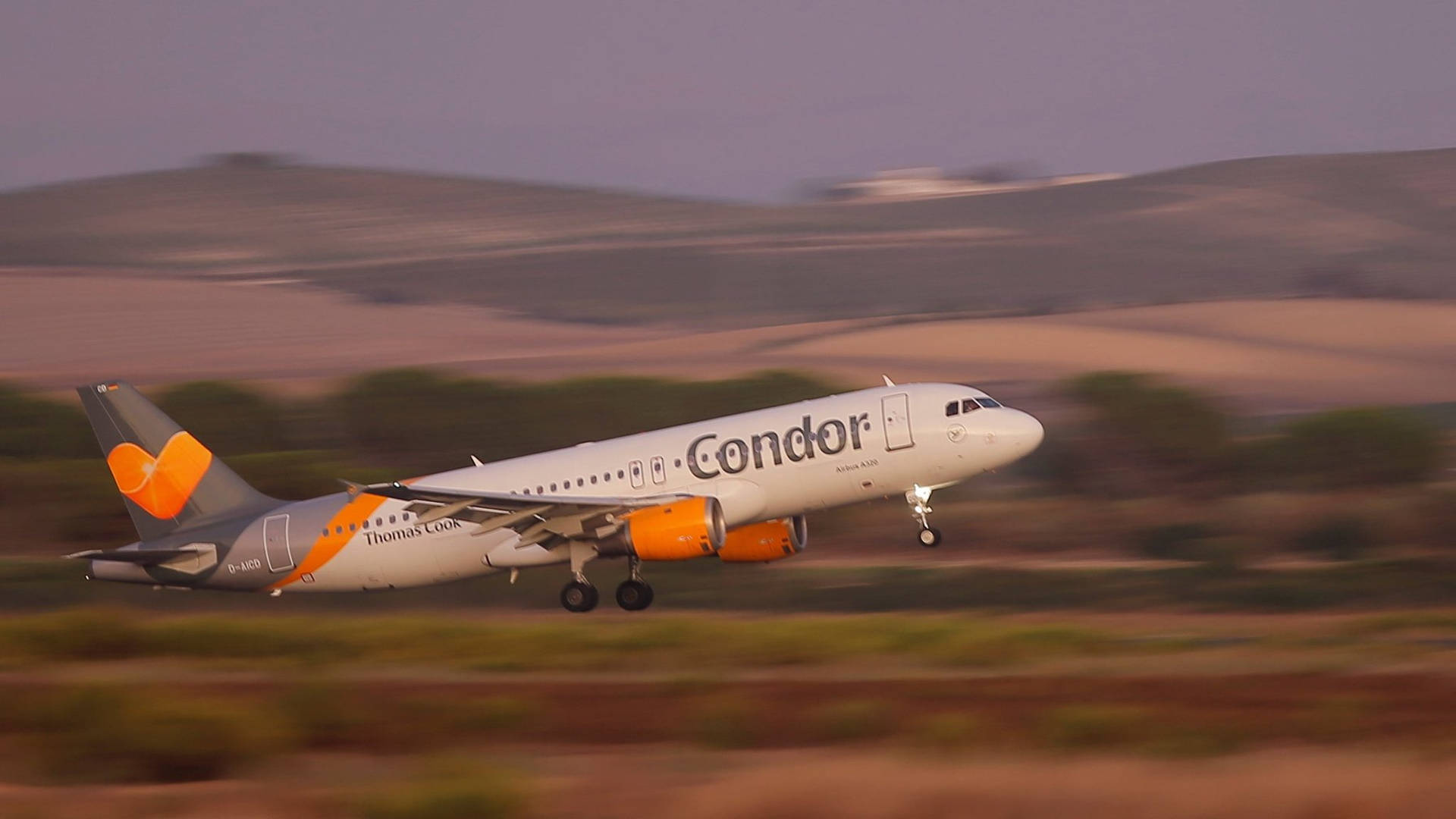 Condor Airlines Plane Ascends To The Skies Background