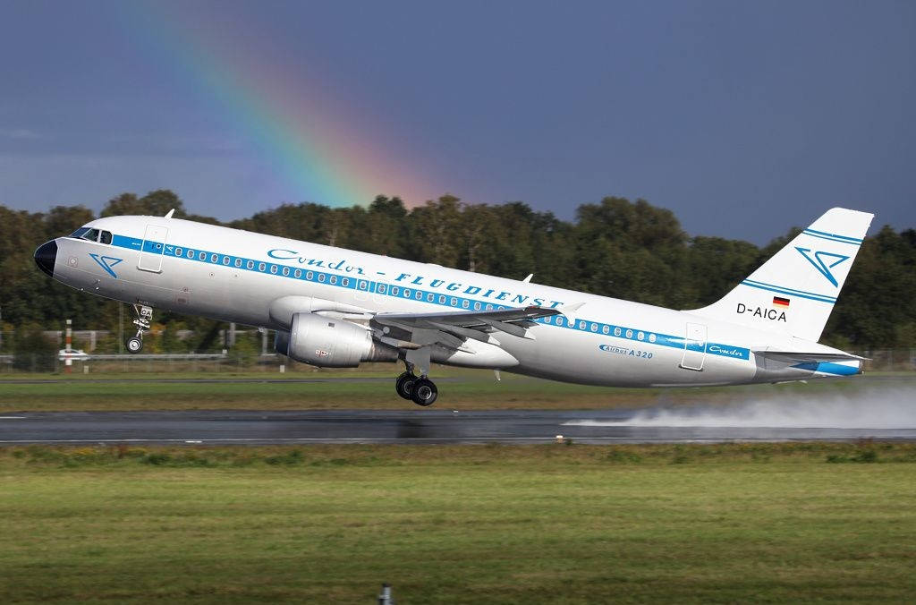 Condor Airlines Plane Take Off With Rainbow Background