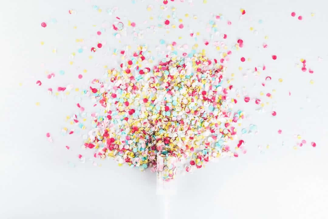 Confetti Falling From A Bottle Background