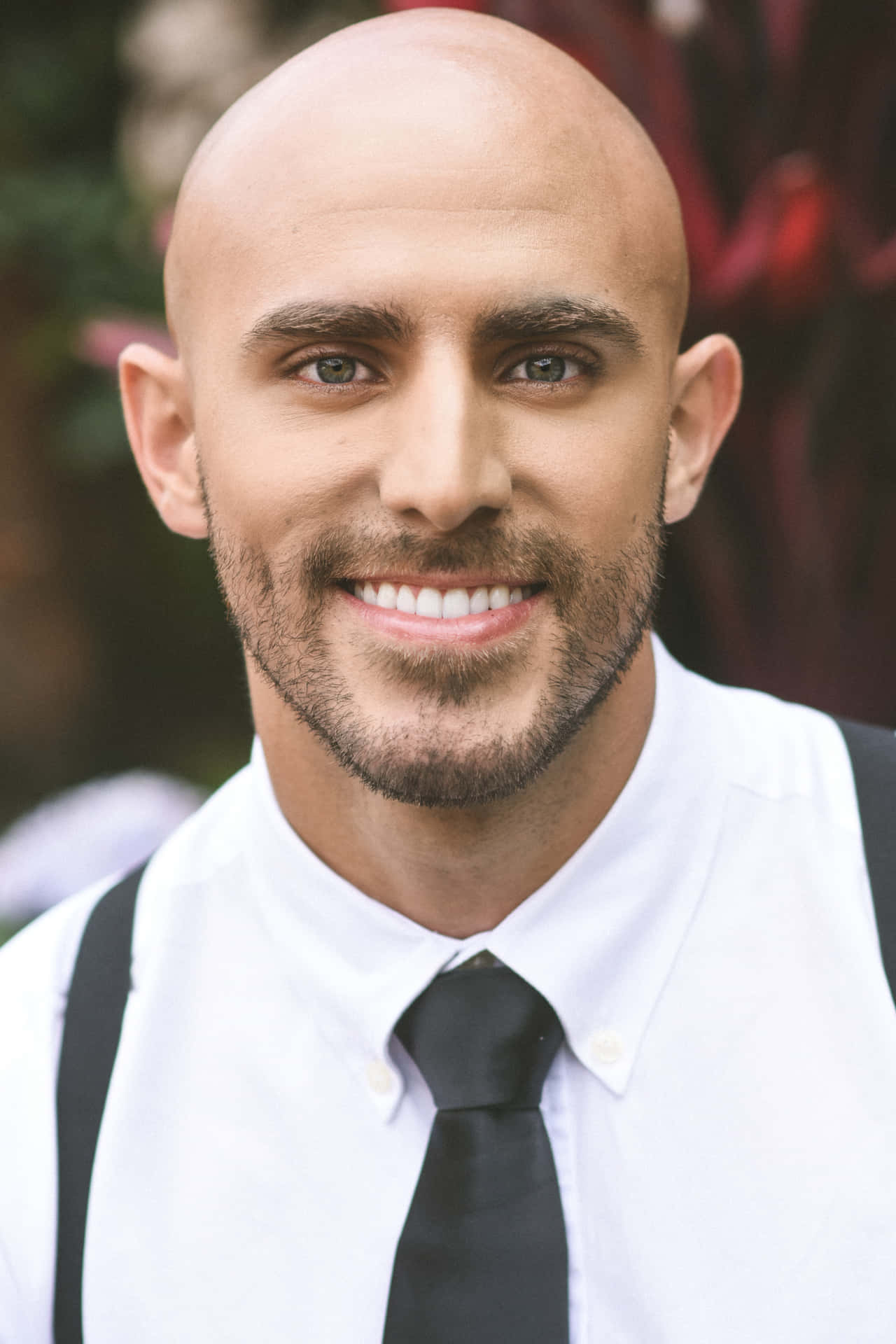 Confident Bald Manin Formal Attire Background