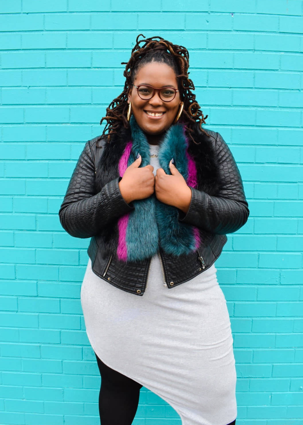 Confident Black Woman Embracing Her Curves In A Teal Background Background