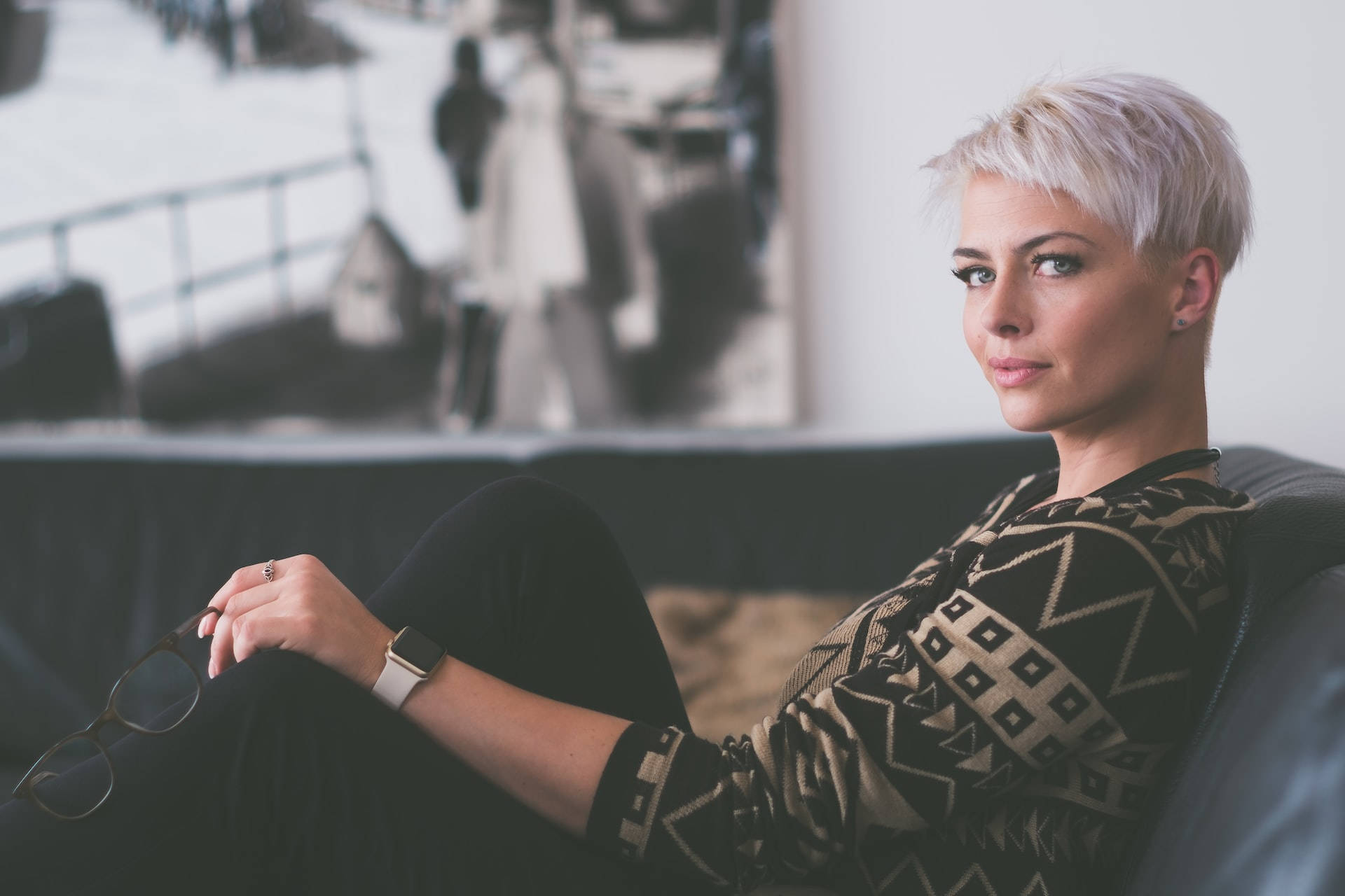 Confident Mature Woman Sporting A Pixie Cut Haircut. Background