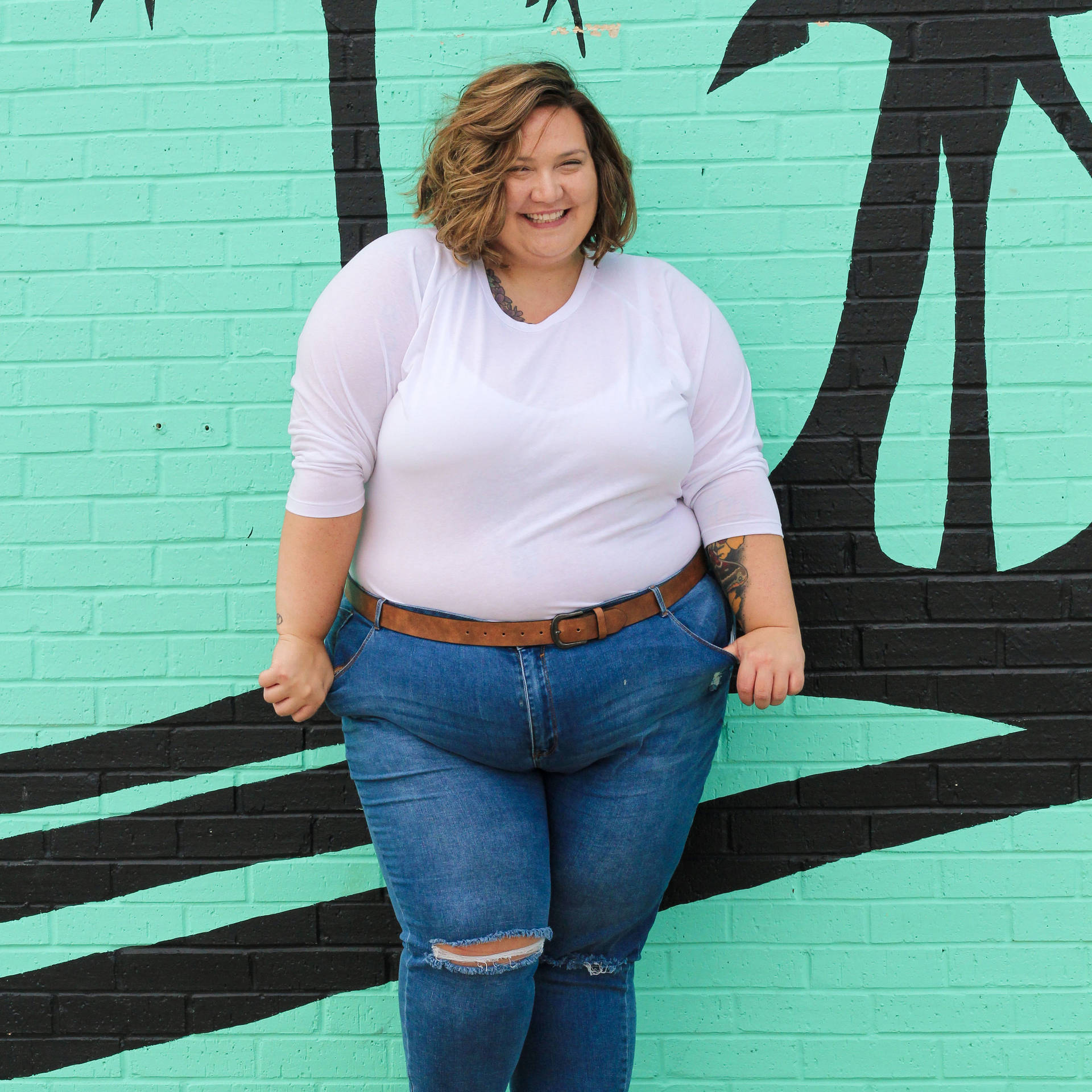 Confident Plus-size Woman Posing In A Green Background Background