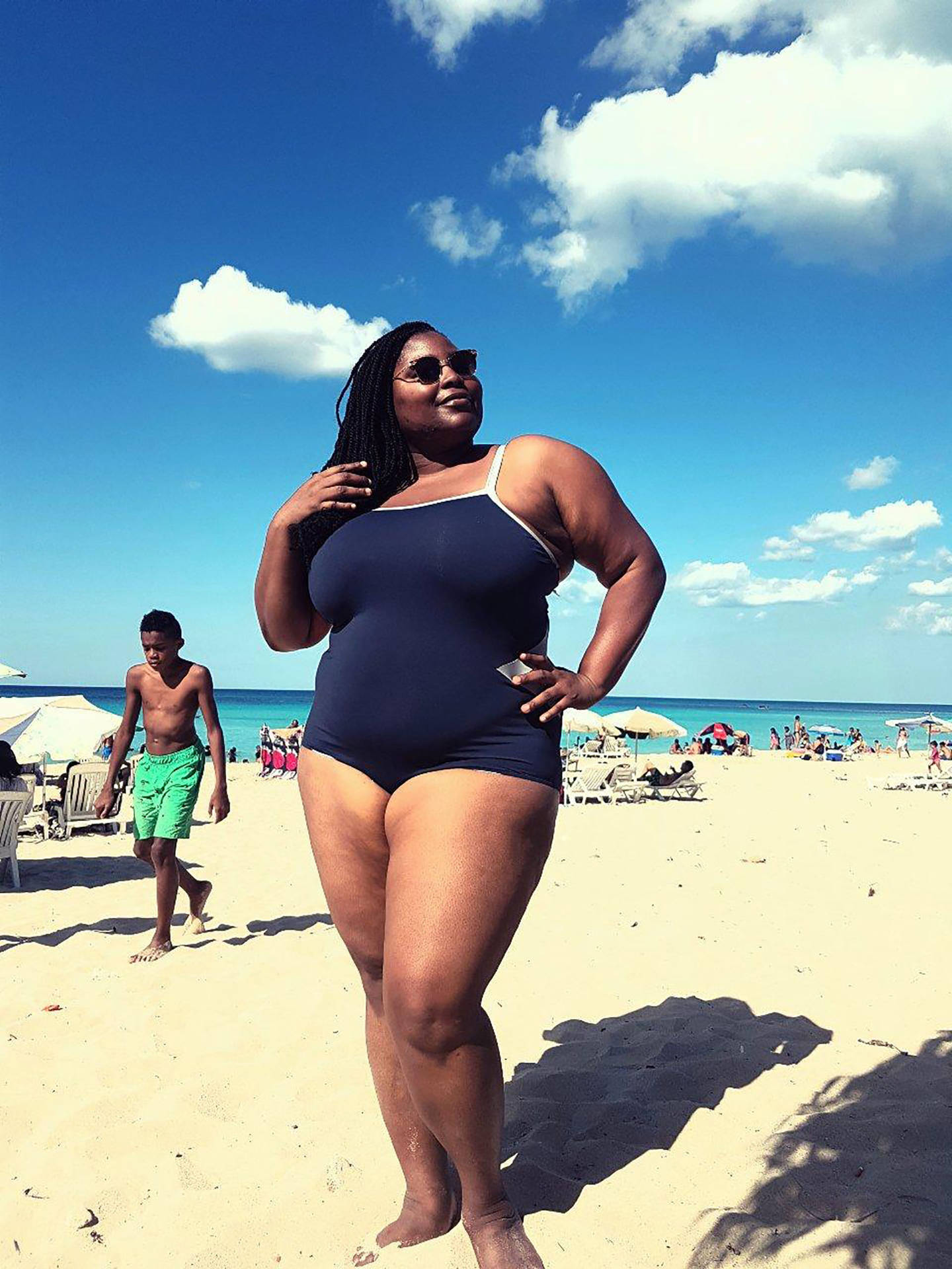 Confident Plus-sized Black Woman In Swimsuit Background