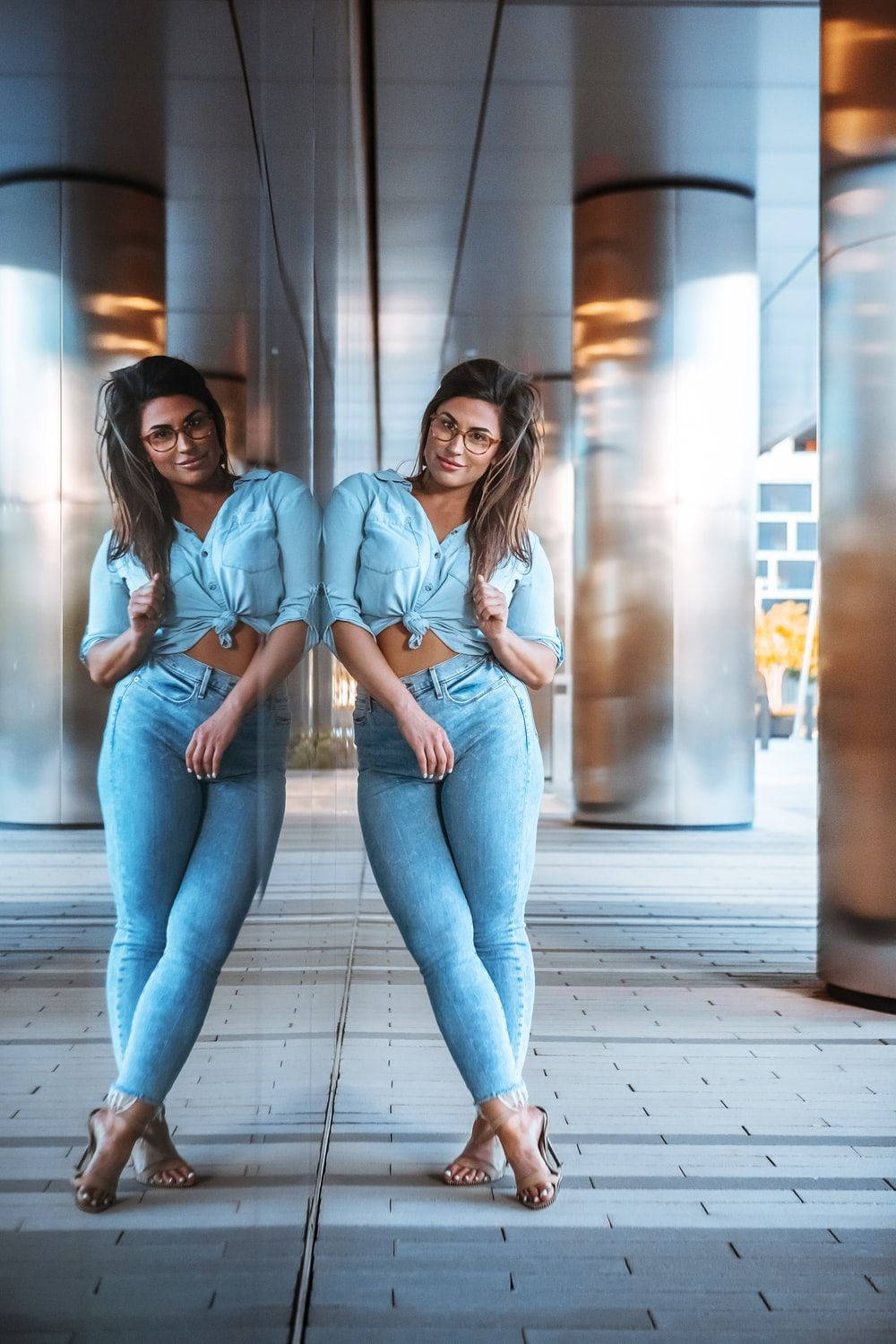 Confident Woman Flaunting Her Beautiful Body In Denim Background