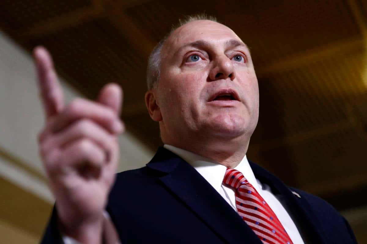 Congressman Steve Scalise Gesturing Upwards During A Public Appearance. Background