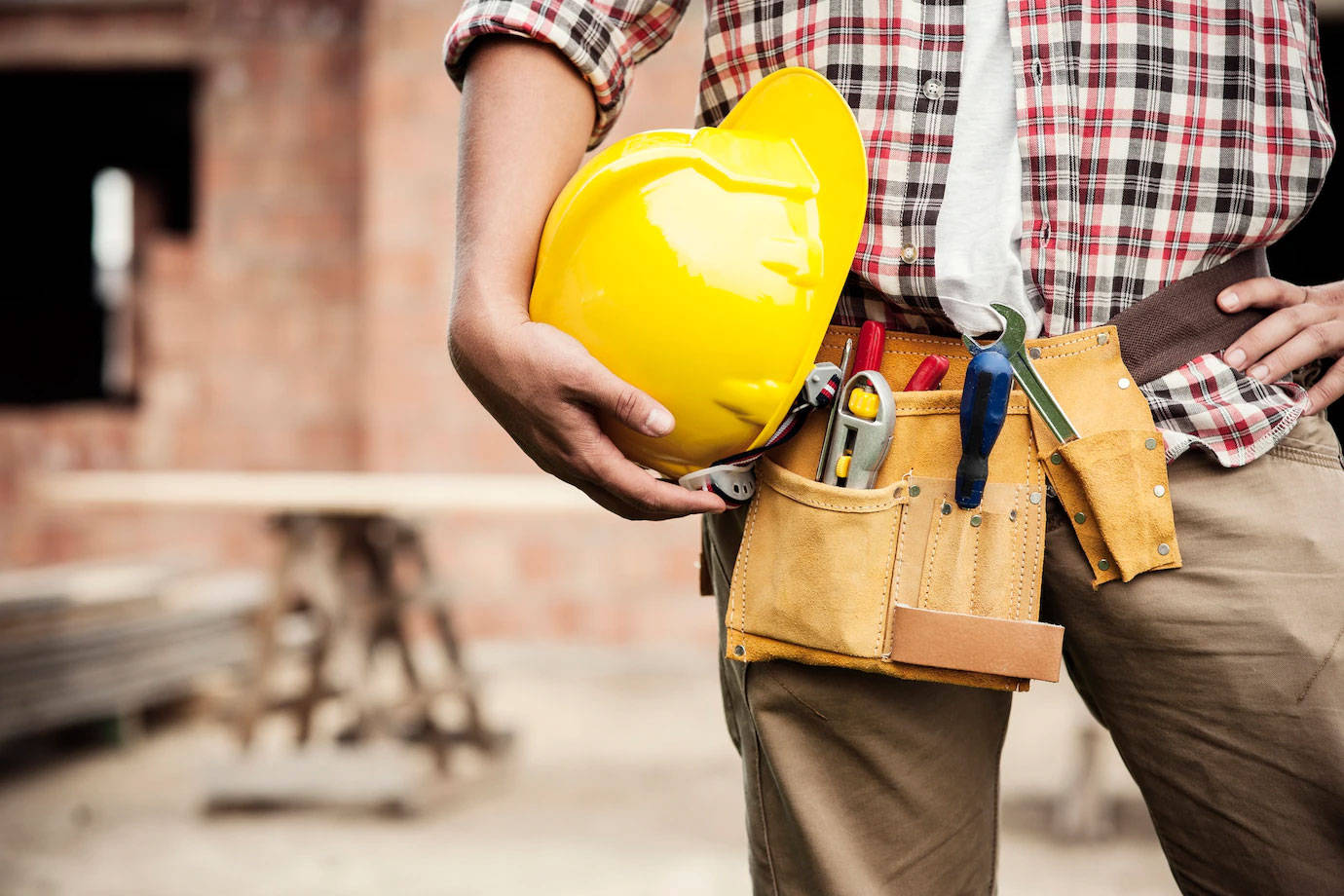 Construction Worker Tools Around His Hips Background