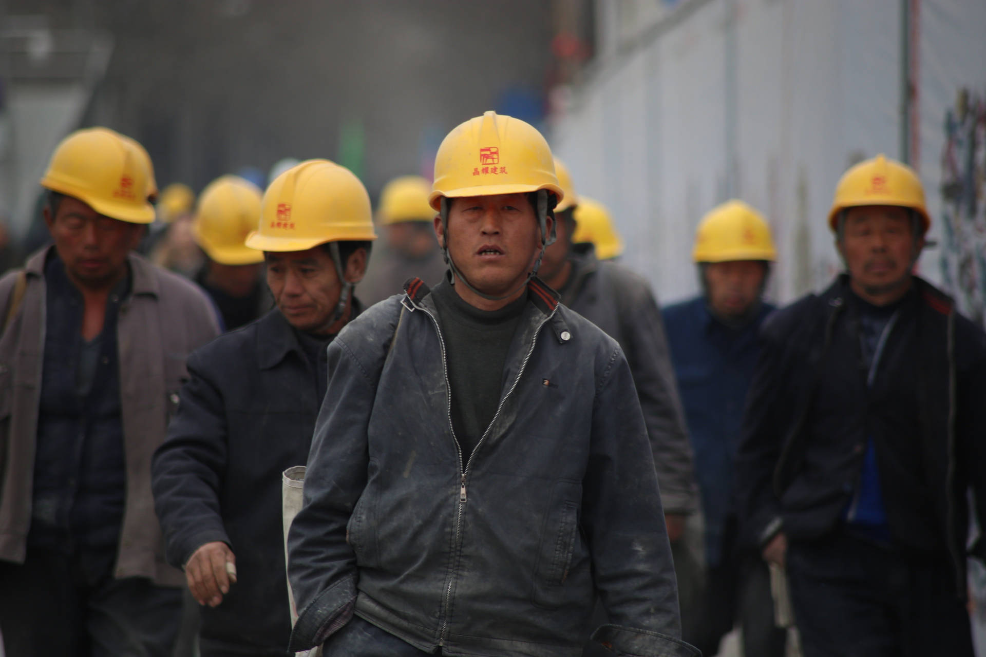 Construction Workers Walking Out Background