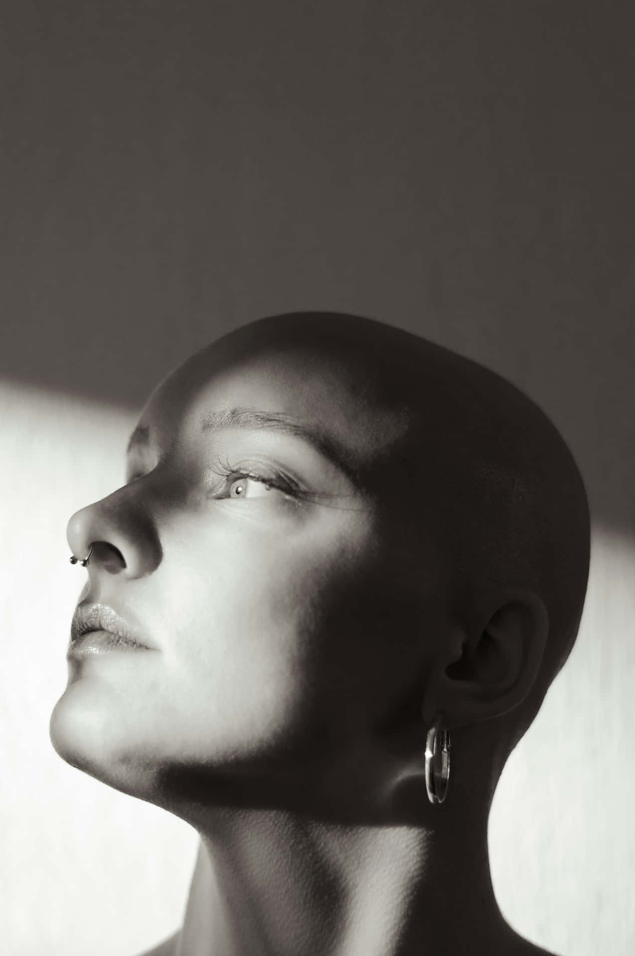 Contemplative Bald Woman Portrait Background