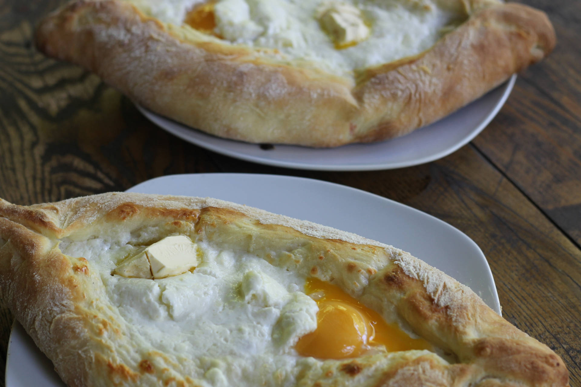 Cooked Khachapuri Breads On Plates Background