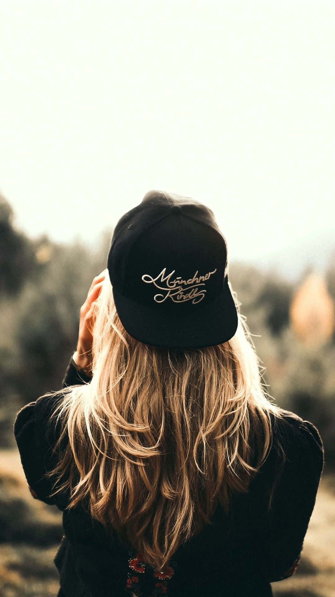 Cool Blonde Girl Wearing Cap Background