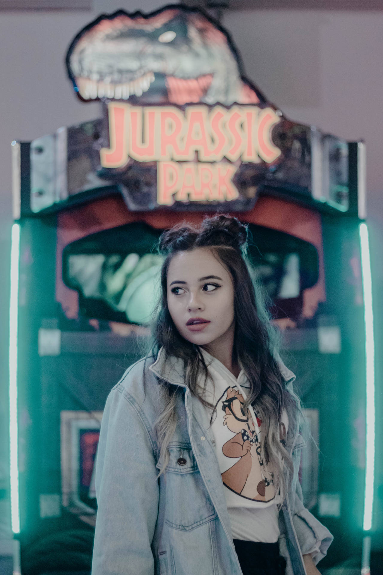 Cool Girl In Jurassic Park Arcade Background