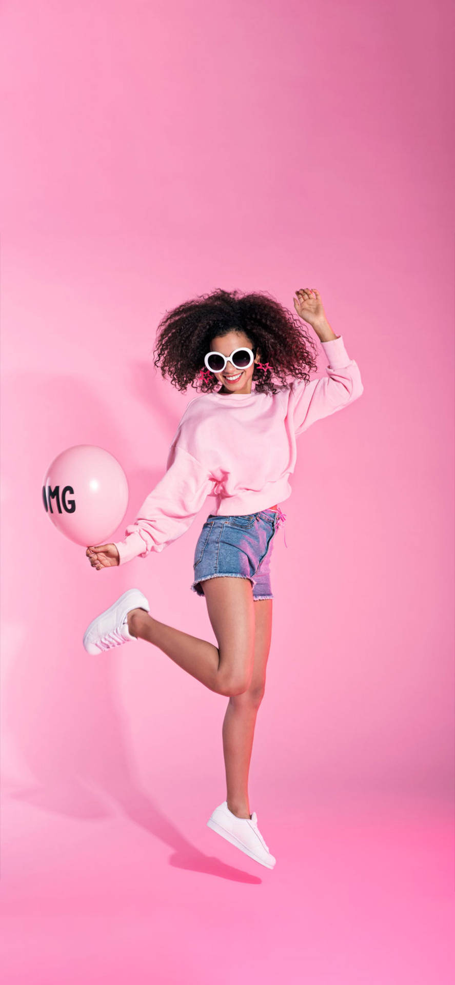 Cool Girl Jumping In Pink Background