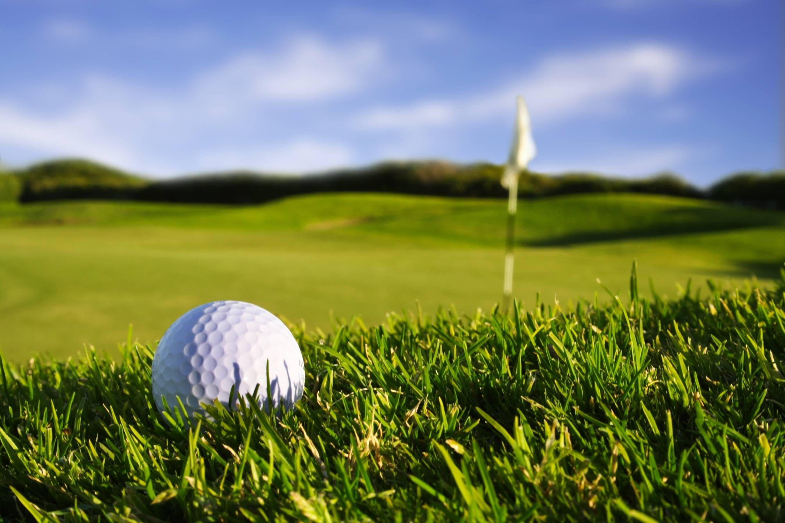 Cool Golf Ball On Course Background
