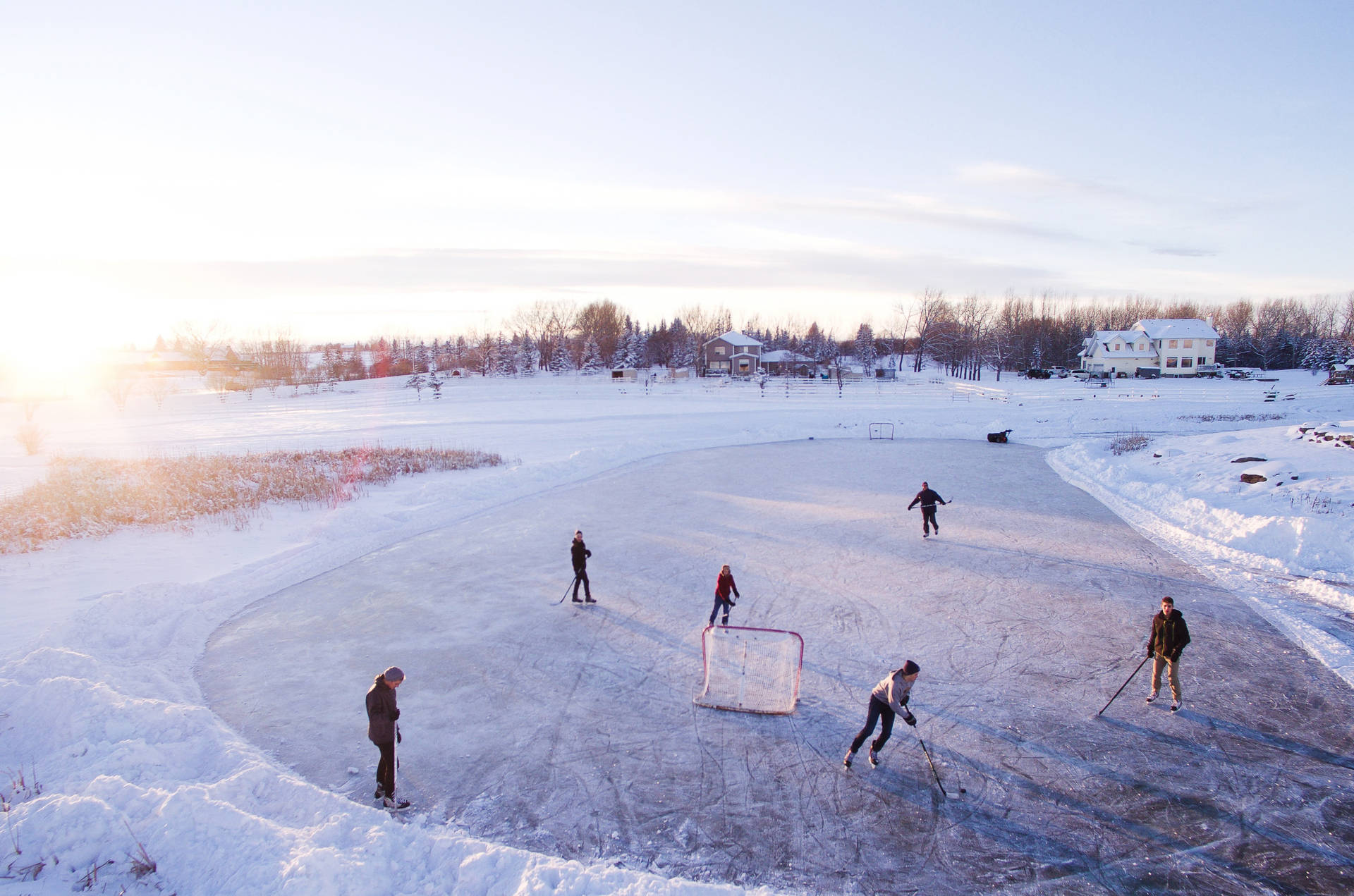 Cool Hockey Players Skate Through The Ice Background