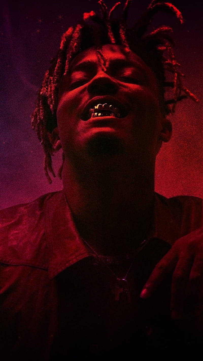 Cool Juice Wrld Showing His Teeth Background