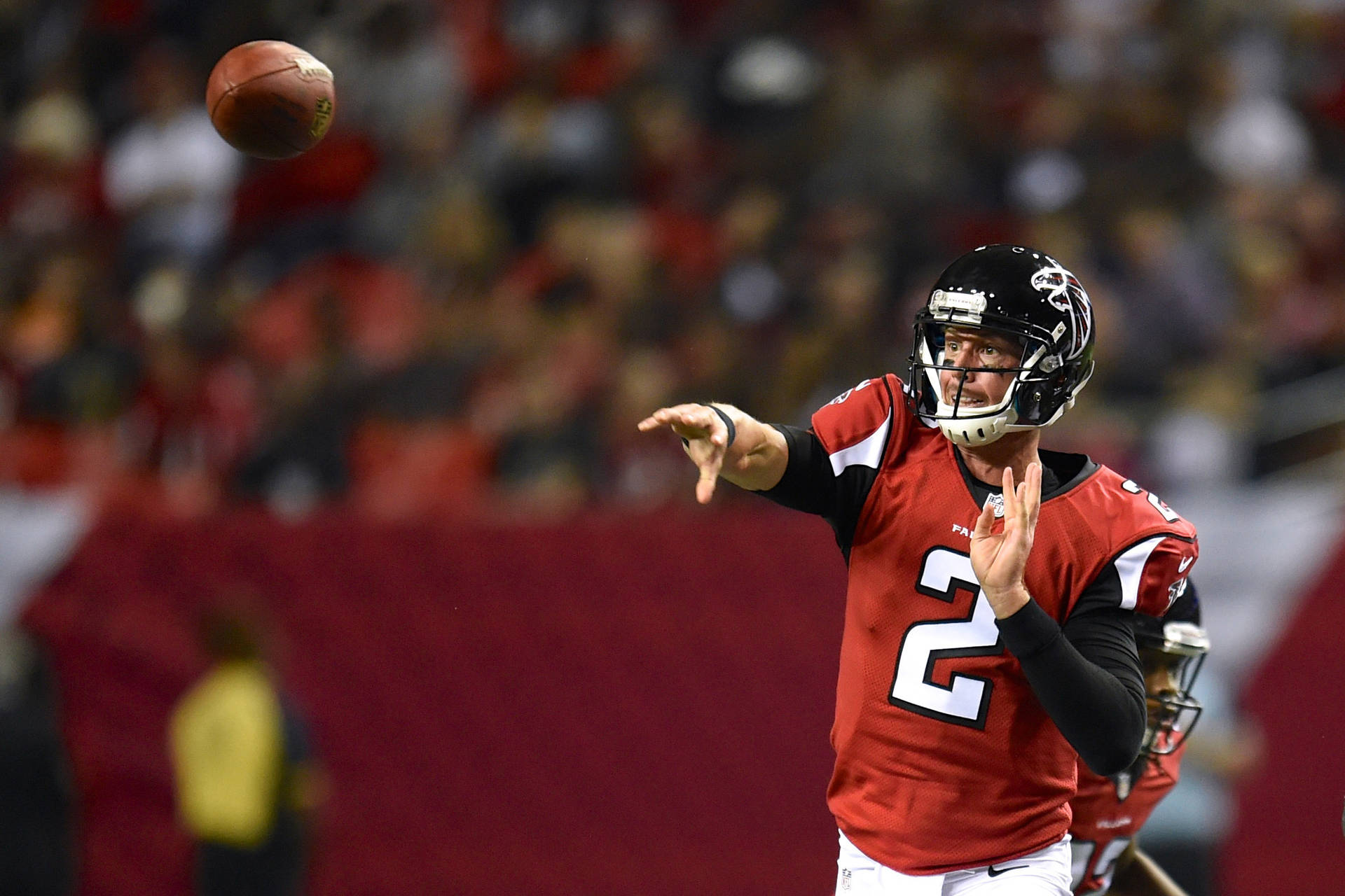 Cool Matt Ryan Throwing A Ball Background