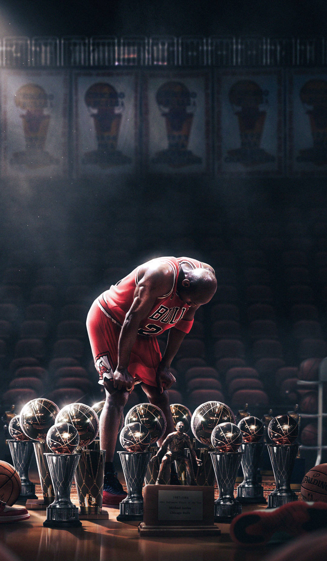 Cool Michael Jordan Trophies In Spotlight Background