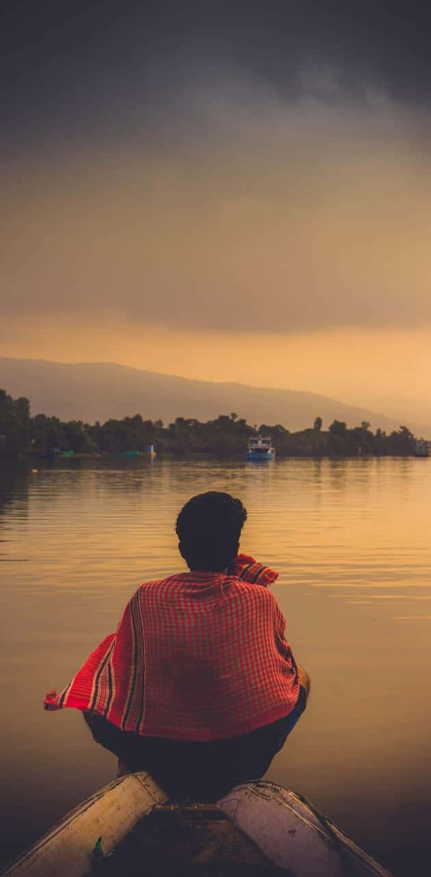 Cool Sad Boy On A Boat Background