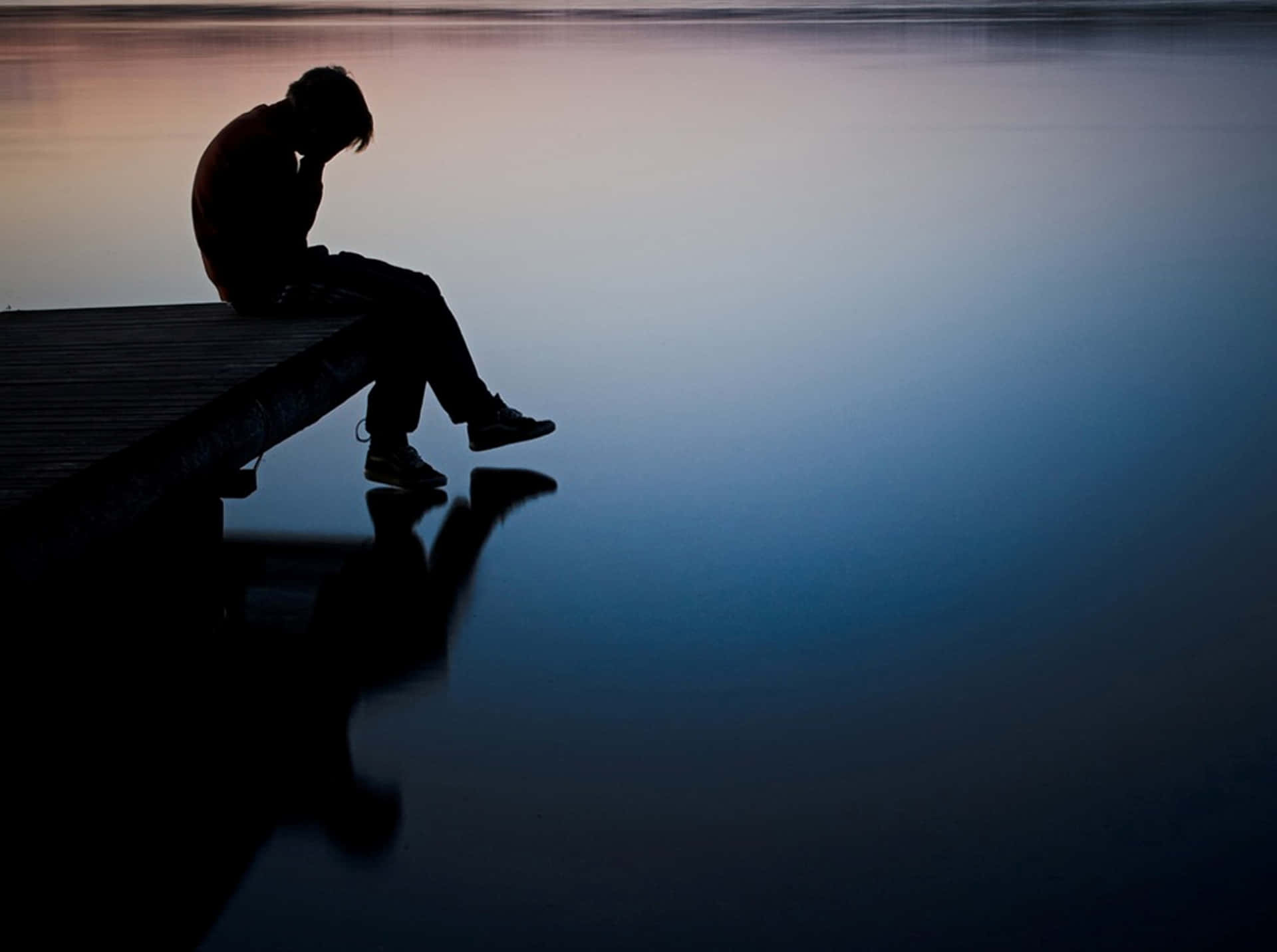 Cool Sad Boy On The Pier Background