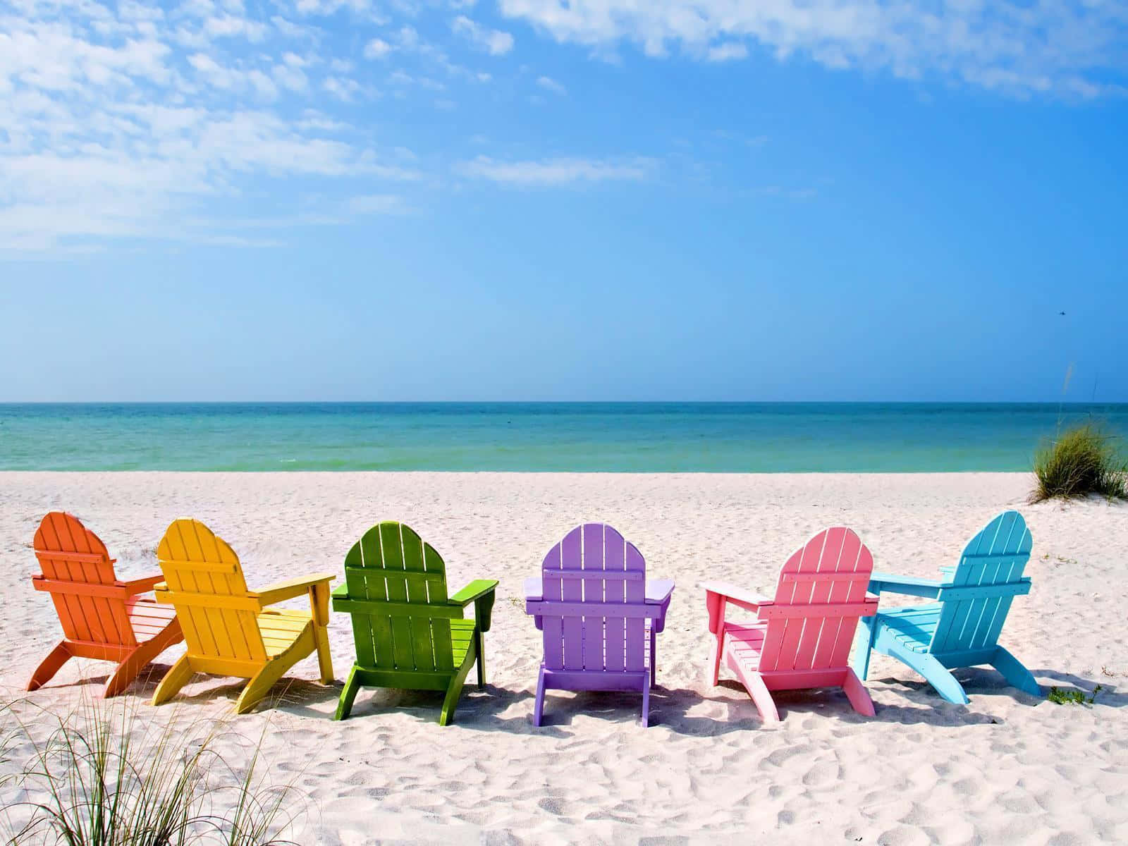 Cool Summer Beach With Colorful Lounge Chairs Background