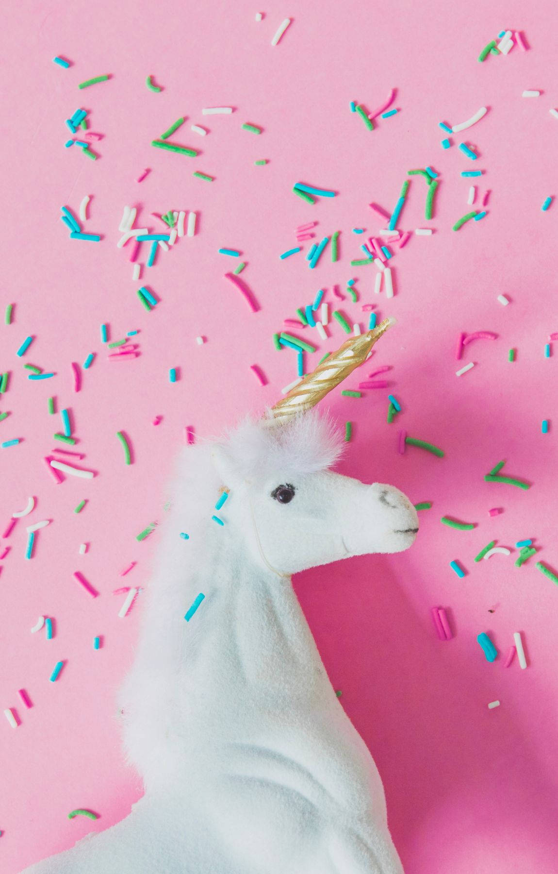 Cool Unicorn Figurine Sprinkles Background