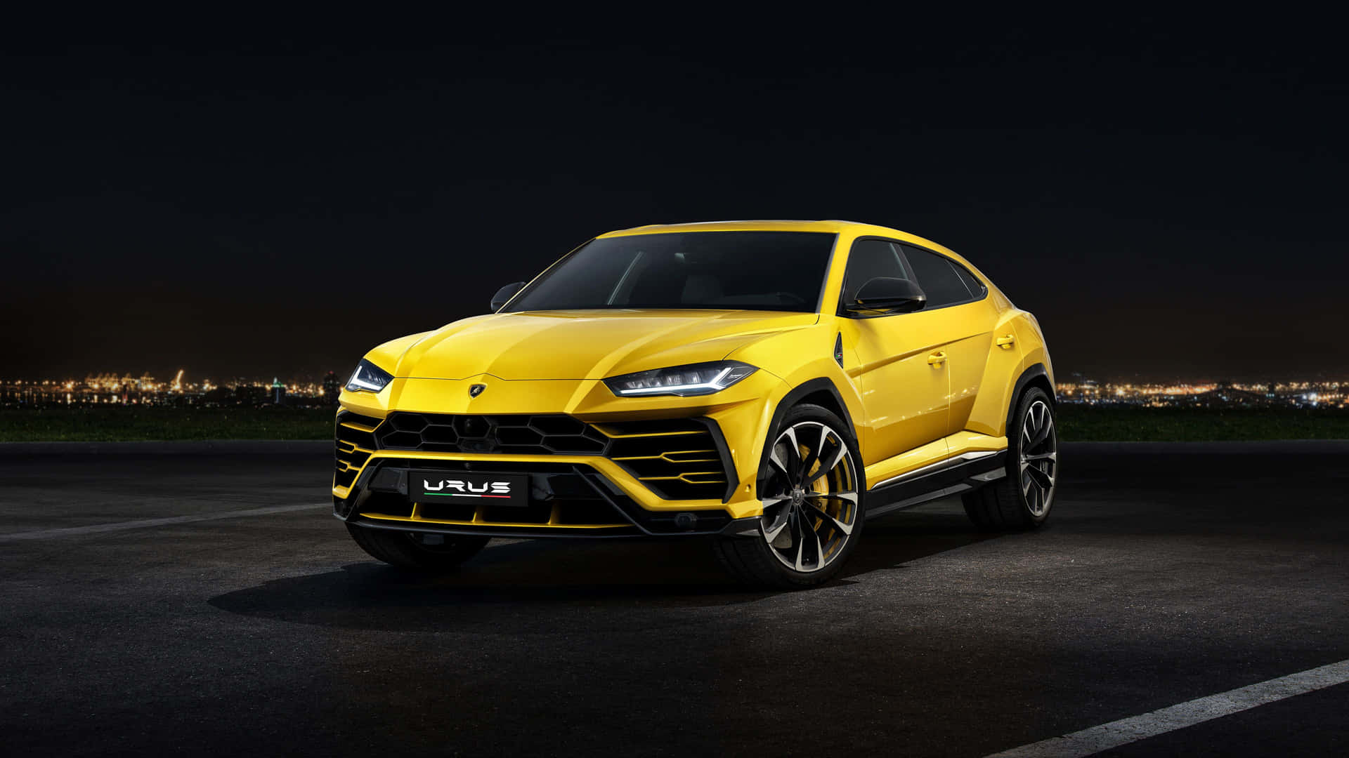 Cool Yellow Lamborghini Urus Sports Utility Vehicle Background