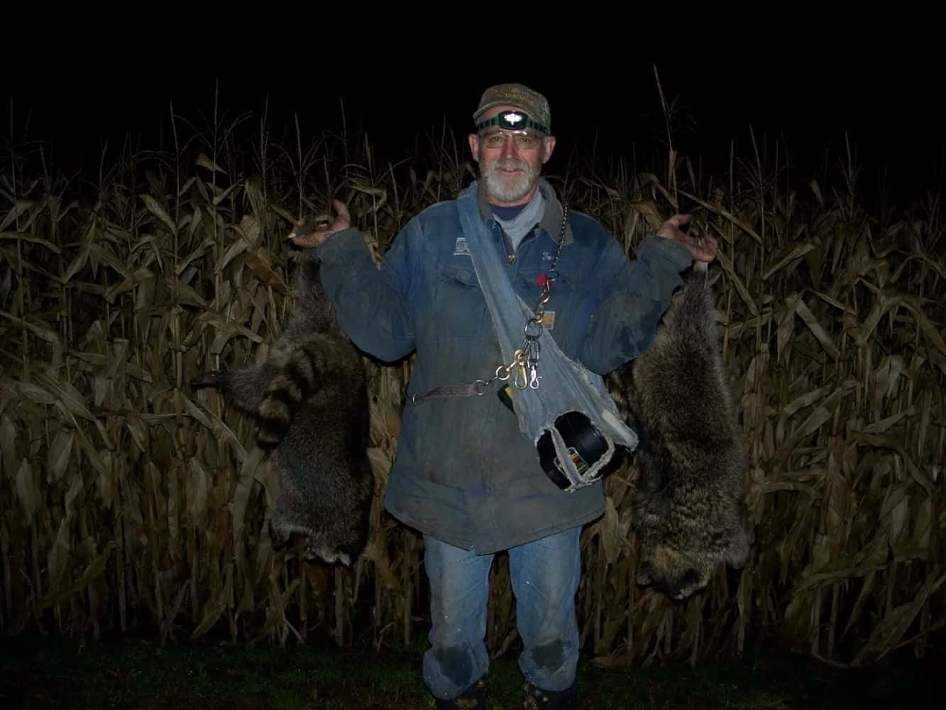 Coon Hunter With Trophies Nighttime